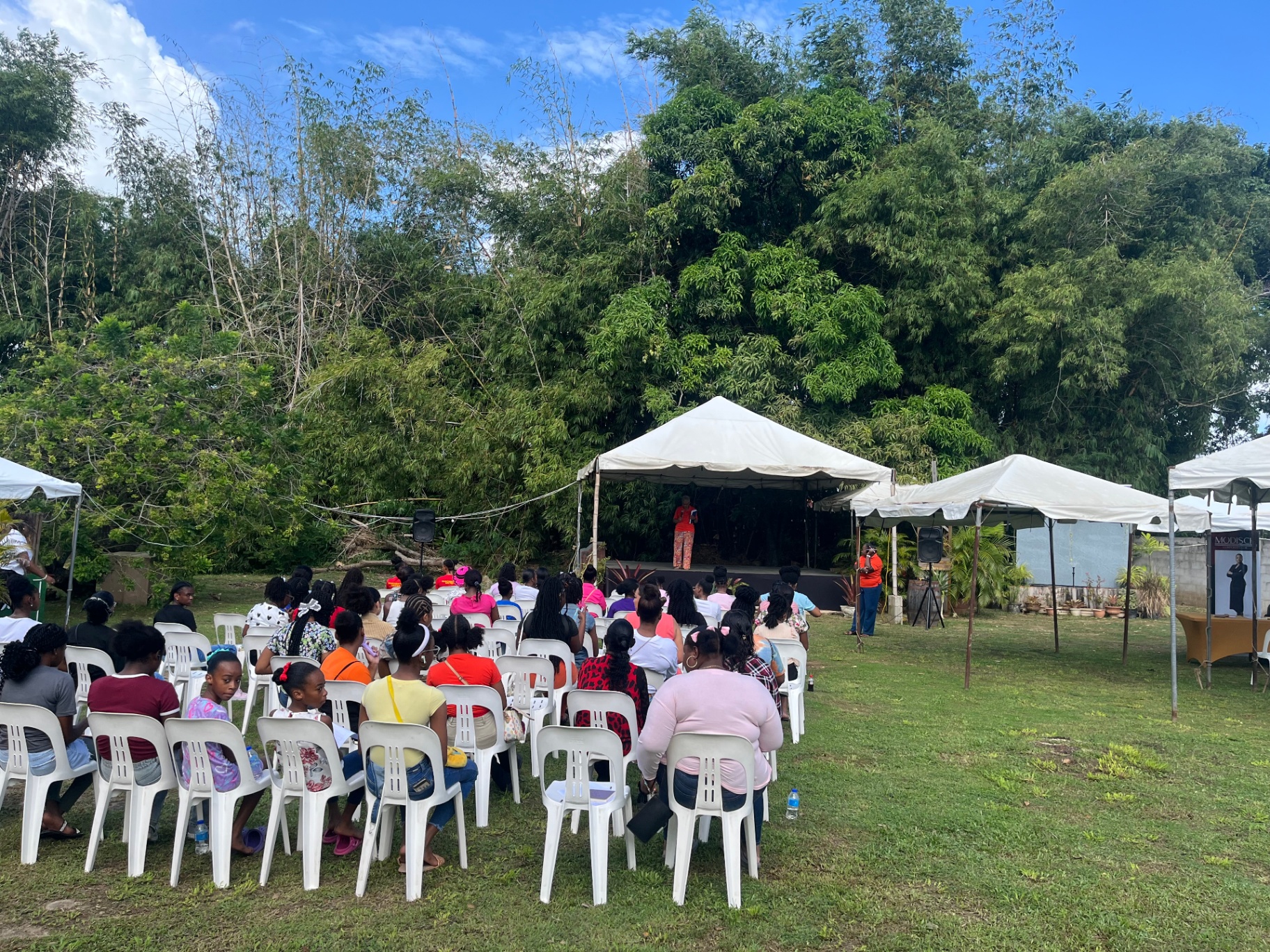 Outdoor presentation hosted by Arouca Soul Kitchen volunteers at a community event in Trinidad and Tobago