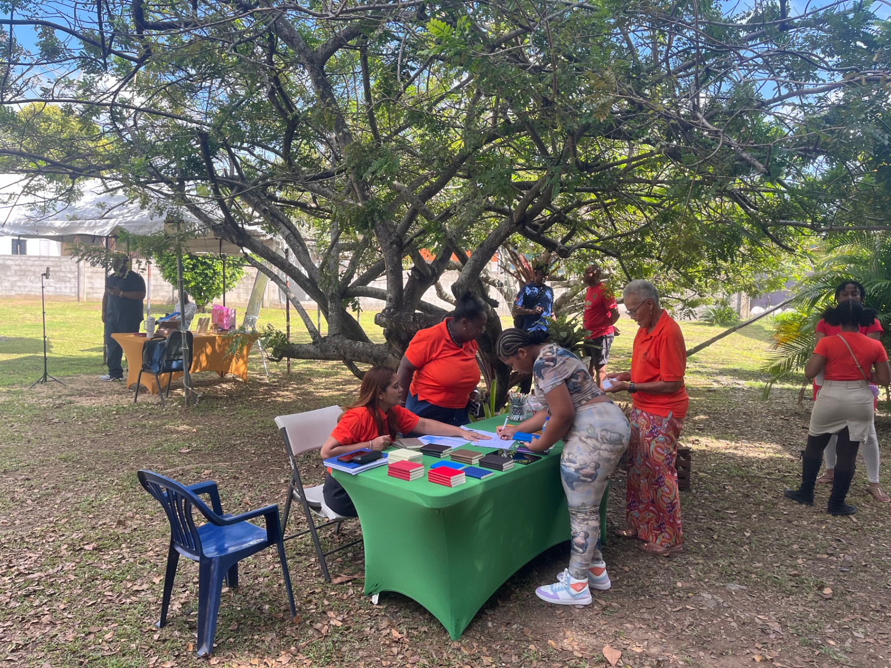 Directors of Arouca Soul Kitchen greeting attendees at a community event in Arouca, T&T