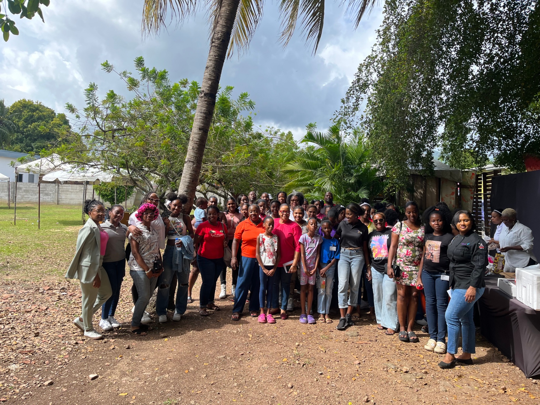 Group photo of all attendees at an event hosted by Arouca Soul Kitchen in Trinidad and Tobago